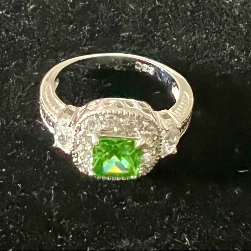 Green peridot stone with clear stones